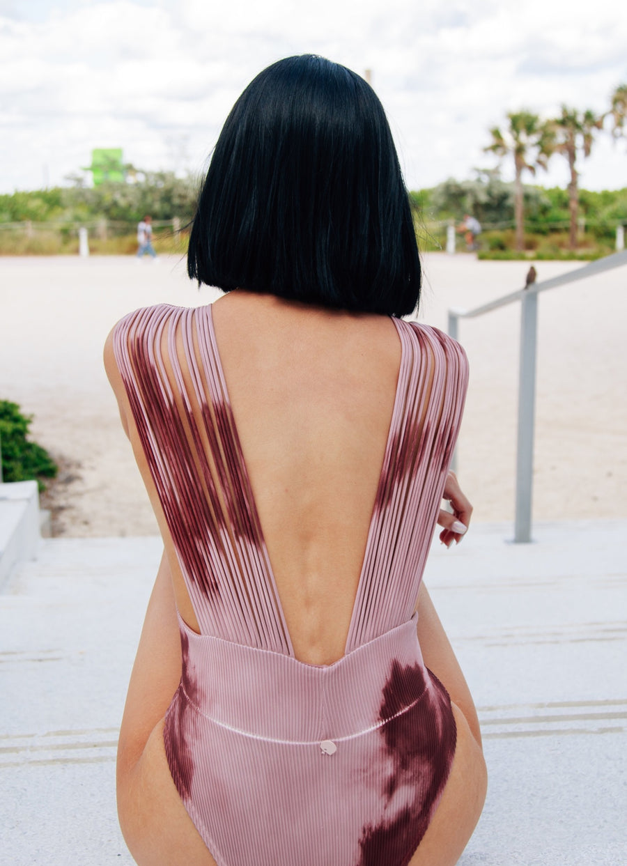 Ribbed one piece hand-dyed in mauve tones.