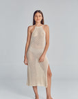 Halter midi dress featuring a side slit, and fully exposed back. Handmade crochet by Peruvian artisans.  50% Cotton, 50% Polyester. Made in Peru